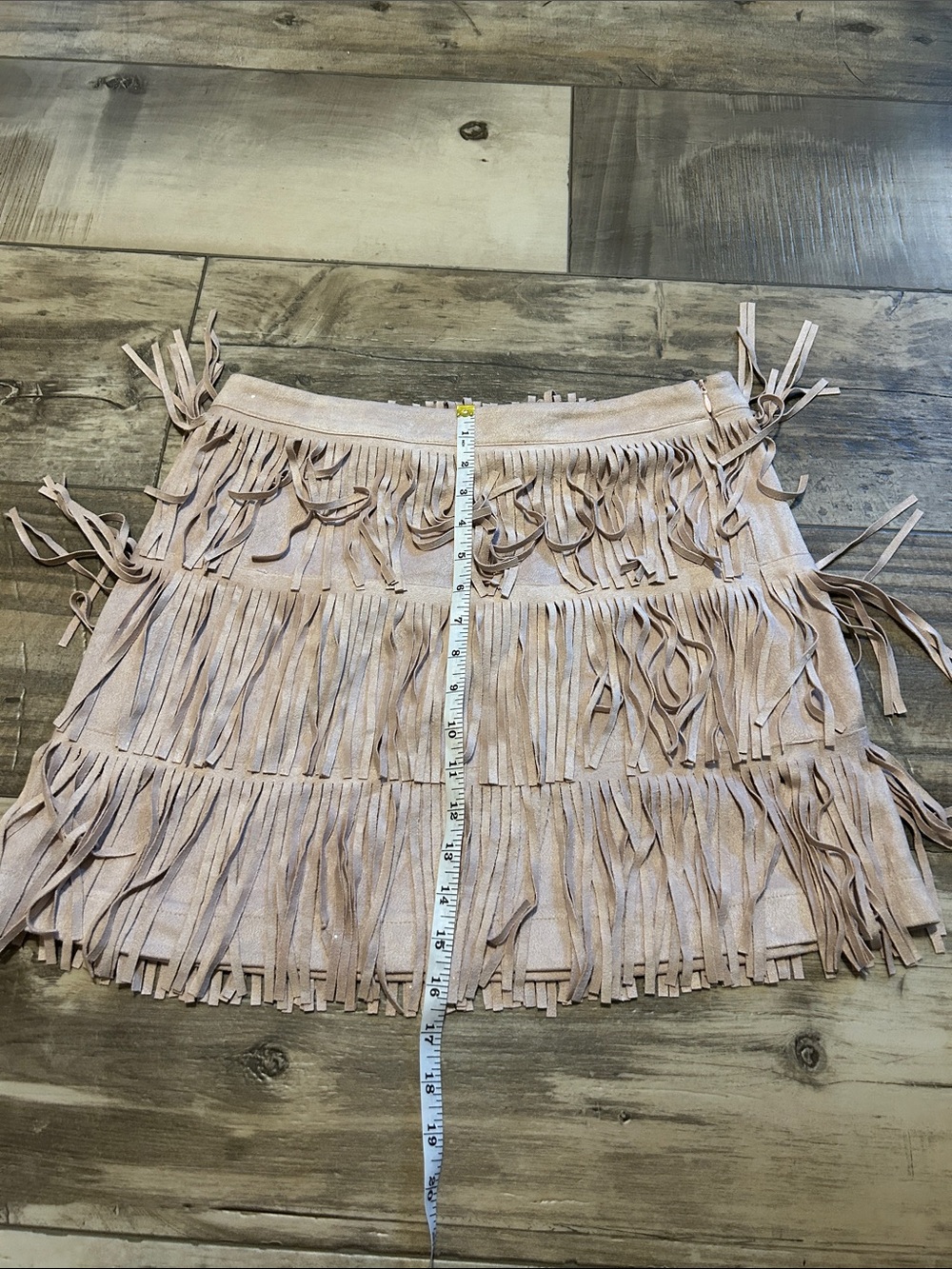 Women’s beige faux suede mini skirt by main strip. Size large